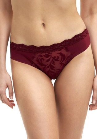 Состав:
Эластичное кружево
ПА 90%
ПУ 10%
Эластичная сетка
ПА 88%
ПУ 12%
Ластовица: 100% хлопок
	Женские классические трусики. Передняя деталь выполнена из эластичной сетки с рисунком. Задняя деталь выполнена  из эластичной сетки и кружева. Поя